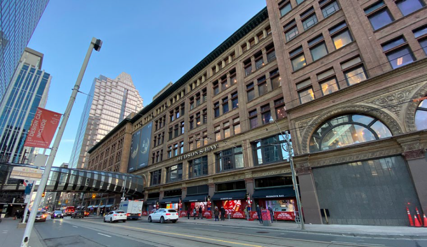 Street view of a historic downtown department store building