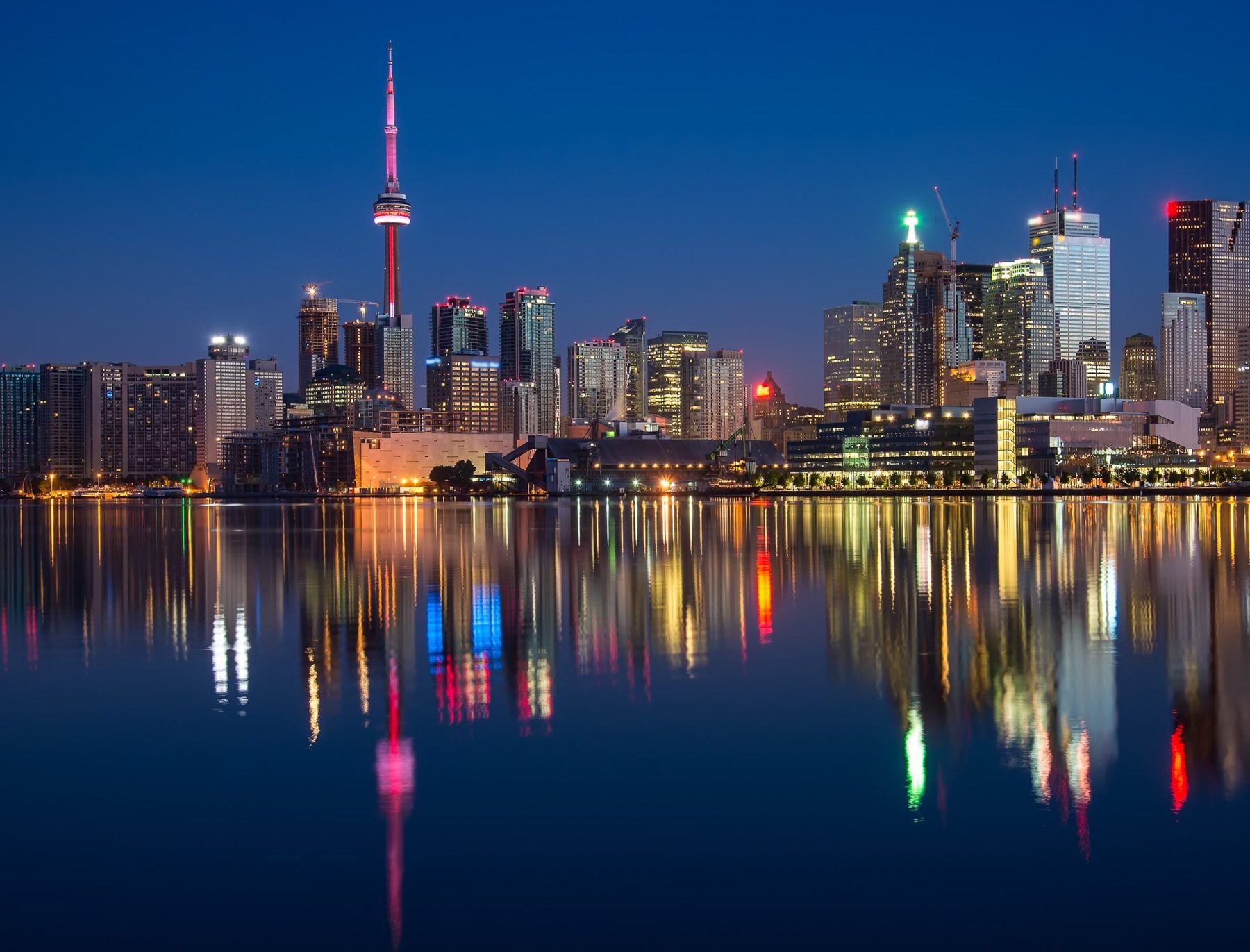 Toronto skyline at night reflected in the harbour